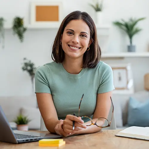 industry-insurance a smiling insurance agent at her desk
